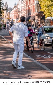 Utrecht, NL - OCT 9, 2021: Group Of Young Students Dressed In White Gathered For A Social Occasion In Utrecht City, Netherlands.