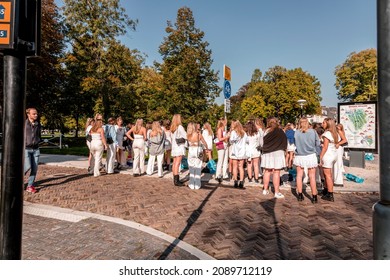 Utrecht, NL - OCT 9, 2021: Group Of Young Female Students Dressed In White Gathered For A Social Occasion In Utrecht City, Netherlands.