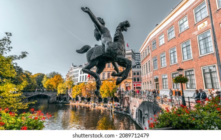 Utrecht, NL - OCT 9, 2021: Traditional Dutch buildings and street view around the beautiful canals of Utrecht city, Utrecht province of the Netherlands.