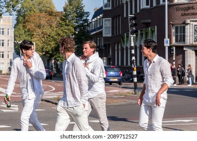 Utrecht, NL - OCT 9, 2021: Group Of Young Students Dressed In White Gathered For A Social Occasion In Utrecht City, Netherlands.