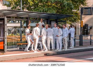 Utrecht, NL - OCT 9, 2021: Group Of Young Students Dressed In White Gathered For A Social Occasion In Utrecht City, Netherlands.