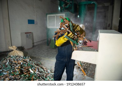 uttarakhand, India, January 29 2021 : Man working on circuit board crusher shredder, Electronic waste recycling plant at haridwar,