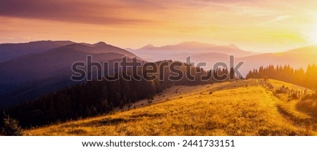 Utterly spectacular view of the sunset over the mountain ranges. Location place Carpathian mountains, Ukraine, Europe. Photo wallpaper. Image of an magical sunset. Discover the beauty of earth.