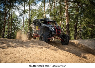 UTV, ATV off road driving in sandy open area. Buggy extreme riding