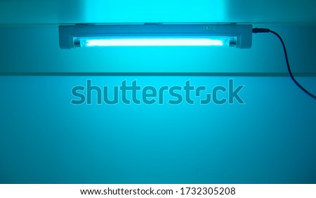 UV lamp sterilization of air and surfaces. Ultraviolet light from the lamp in laboratory. Coronavirus epidemic prevention concept. Copy space