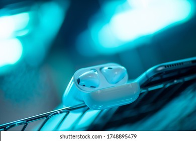 UV light sterilization of smartphone and earbuds. COVID-19 prevention concept.