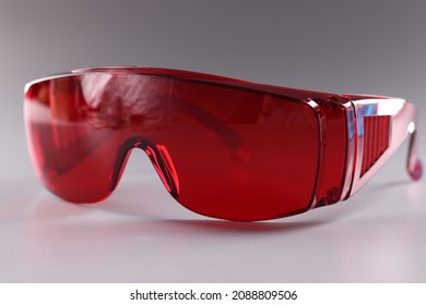 UV Protective Goggles On Gray Background. Laser Eye Protection