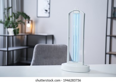 UV Sterilizer Lamp On Table At Home. Space For Text