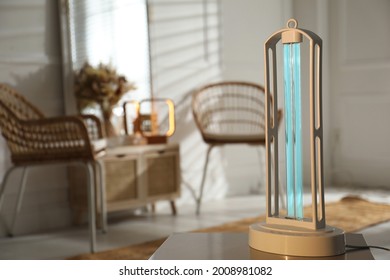 UV Sterilizer Lamp On Table At Home. Space For Text