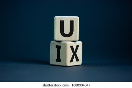 UX design or UI design. Turned cube and changed word 'UX - user experience' to 'UI - user interface'. Beautiful grey background. Business and UI or UI concept. Copy space. - Shutterstock ID 1888304347