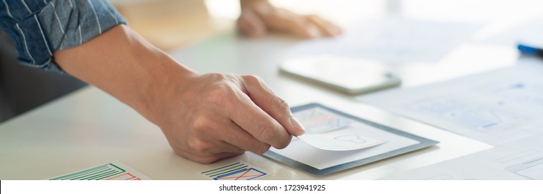 ux designer creative planning application development near layouts of mobile smartphone frameworks, User experience concept