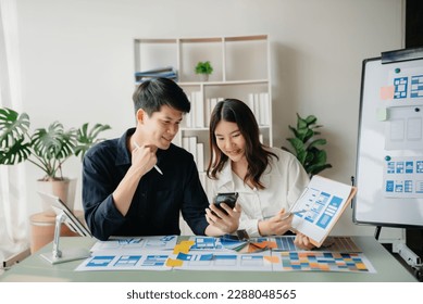  UX developer and ui designer brainstorming about mobile app interface wireframe design with customer breif and color code. business working - Shutterstock ID 2288048565