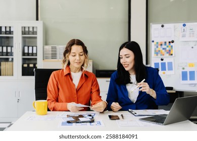 UX developer and ui designer brainstorming about mobile app interface wireframe design with customer breif and color code, User experience concept.	