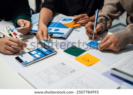 UX developer and ui designer brainstorming about mobile app interface wireframe design with customer breif and color code, User experience concept