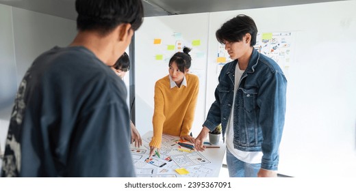 Ux developer and ui designer use augmented reality brainstorming about mobile app interface wireframe design on desk at modern office. creative digital development agency - Shutterstock ID 2395367091