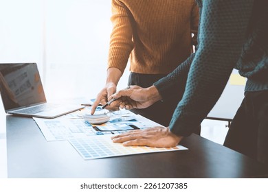 ux developers and ui designers, data researchers brainstorm on  tabletop mobile app interface wireframe design with client summary color codes the modern office Creative Digital Development Agency. - Shutterstock ID 2261207385