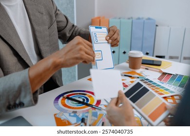 UX graphic designer planning application process development prototype, software development team, copy space, collaboration UX developer and UI designer, team analyzing mobile app interface