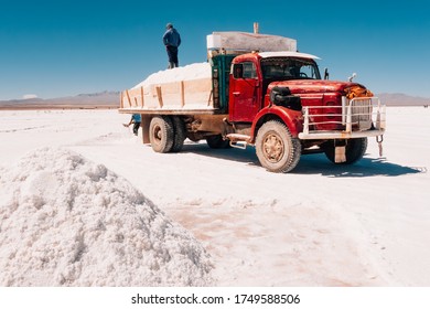 Uyuni, Bolivia, August 13, 2012: Truck With Workers Loading Salt In Uyuni Desert Bolivia