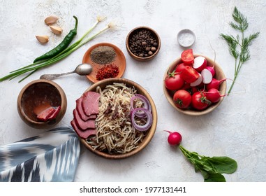 Uzbek Food Naryn With Chopped Dough And Meat. Served With Vegetables And Spices. Flatlay View