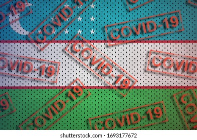 Uzbekistan flag and many red Covid-19 stamps. Coronavirus or 2019-nCov virus concept