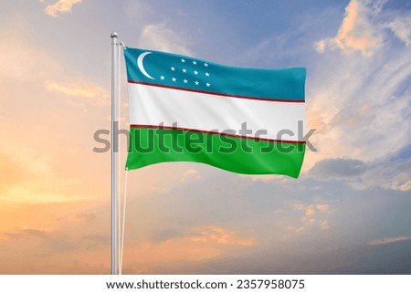 Uzbekistan flag waving on sundown sky