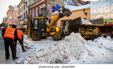Uzhgorod, Ukraine - January 19, 2017: Employees of municipal services, clean snow from pavements in the city center.