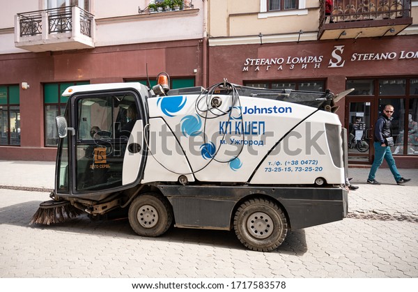 UZHHOROD, UKRAINE - APRIL 28,\
2020: Street sweeper machine. Car cleaning the road in Uzhhorod,\
Ukraine