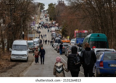 Uzhhorod, Ukraine - February 26, 2022: Long queues of Ukrainian refugees fleeing Russian aggression to Europe across the Slovak border.
