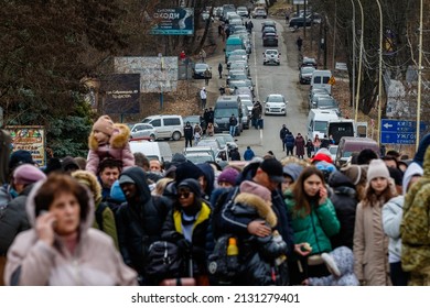 Uzhhorod, Ukraine - February 26, 2022: Refugees are waiting for permission to cross the border into Europe through the Ukrainian-Slovak border.