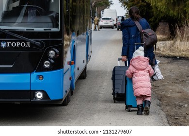 Uzhhorod, Ukraine - February 26, 2022: Ukrainian Refugee With A Child Leave The Country On The Slovak Border Fleeing Russian Aggression Against Ukraine.