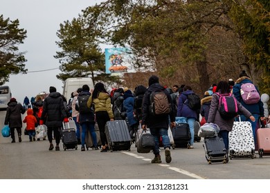 Uzhhorod, Ukraine - February 26, 2022: Ukrainian refugees with things rush to the Slovak border fleeing Russian aggression against Ukraine.