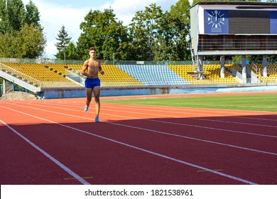 UZHHOROD, UKRAINE - SEPTEMBER 5, 2020: Male Teen Athlete Training On A Running Track On A Stadium. Male Runner Training On A Running Track In Uzhhorod, Ukraine