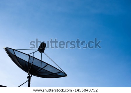 V receiver plate Satellite dish above the roof of the building, communication technology in the digital world

