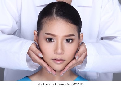 V Shape Face Checking Diagnose By Beautician Doctor, Put Hands On Patient Face. Studio Lighting White Background Isolated