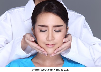 V Shape Face Checking Diagnose By Beautician Doctor, Put Hands On Patient Face. Studio Lighting White Background Isolated