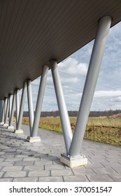 V- shaped metal pillars as construction under roof of building