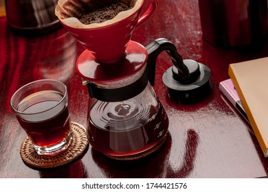 
V-60 coffee, artisan method,
It is made by pouring hot water over ground and roasted coffee using a paper filter. - Shutterstock ID 1744421576