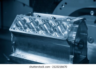 The v8 engine aluminum cylinder block in the light blue scene. The high performance automotive part manufacturing concept.