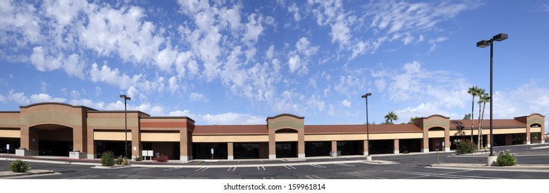 Vacant Business Offices And Shopping Mall With Empty Parking Lot For Rent