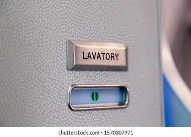 Vacant Green Sign, Vacant Symbol On An Airplane Lavatory Door. Raised, Brushed Metal Lavatory Sign, Recessed Plastic Vacant Sign. Toilet Room, Wc, Closet On Airplane Board