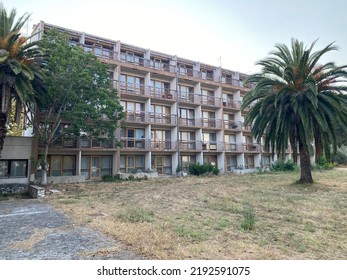 Vacant Hotel Building With Palm Trees