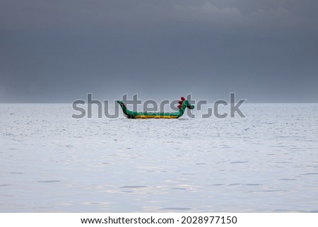 Vacant Inflatable water attraction in the sea against the background of dark sky. High quality photo