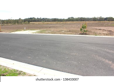 Vacant land in a new real estate subdivision in australia with new road in foreground