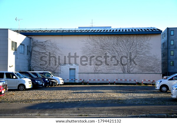 Vacant land plot in Sapporo, Hokkaido /Japan-\
November 1 2018 : Usage of in vacant land plot for on ground\
parking lot, Concept image for city transportation and real estate\
investment tax in Japan.