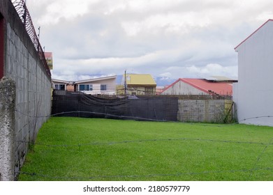 Vacant Lot Of Land For Sale And Active Construction Site In The Background 