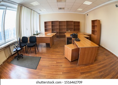 Vacant Office With Furniture Or Abandoned Office Space With No People, Wide Angle View