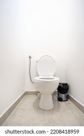 Vacant Toilet Seat In A Small Bathroom. Low Angle Shot, No People.