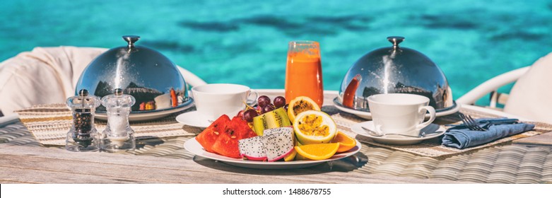 Vacation breakfast table at luxury restaurant or hotel room panoramic banner. Romantic cruise honeymoon travel holiday in Maldives or Tahiti.