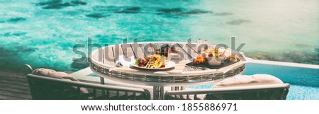 Vacation brunch food table at luxury restaurant hotel suite private terrace panoramic banner. Romantic cruise honeymoon travel destination holiday in Maldives or Tahiti. Stock photo © 