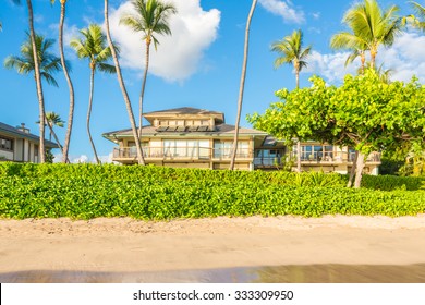 Vacation Cottages On The Beach With Palms, Maui, Hawaii.